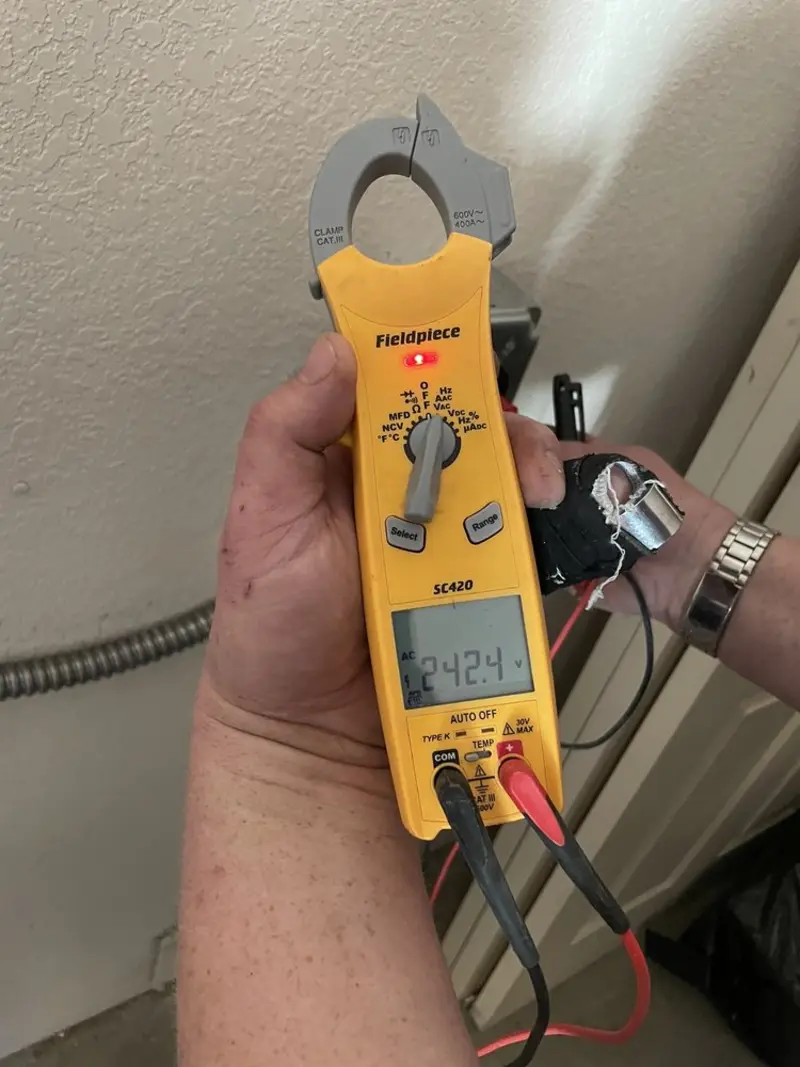 Voltage testing with clamp meter during Circuit Breaker Repair in New Richmond